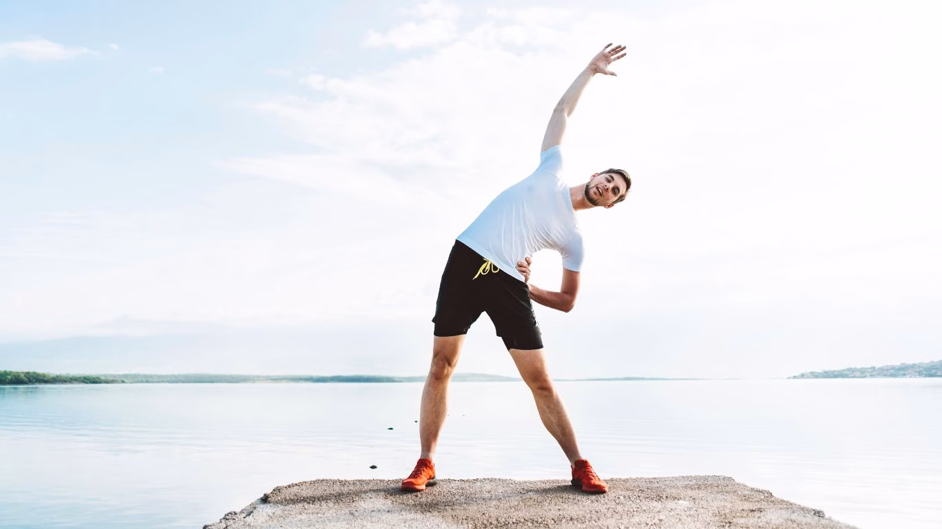 A man stretching gently using somatic movement
