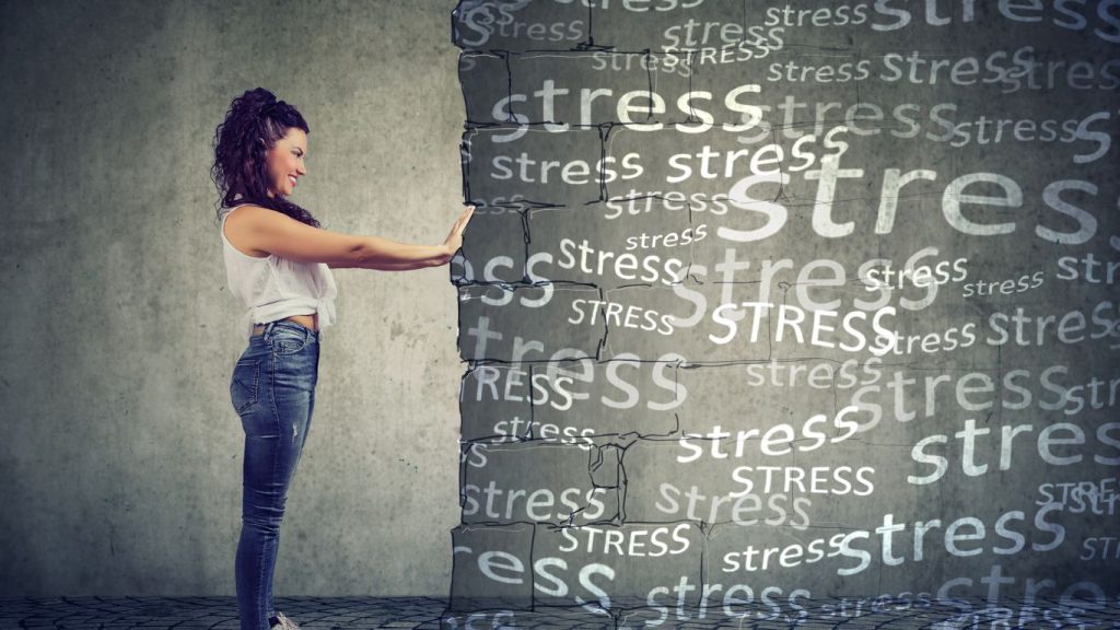 Image of a woman pushing the word stress