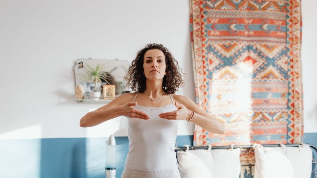 Woman breathing in and looking calm