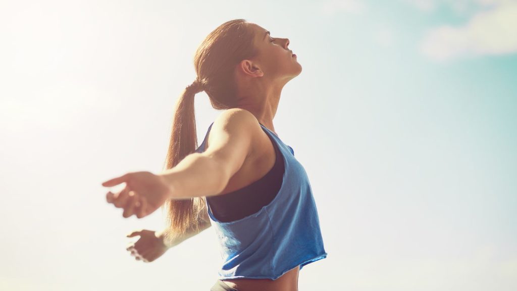Image of woman with arms outstretched