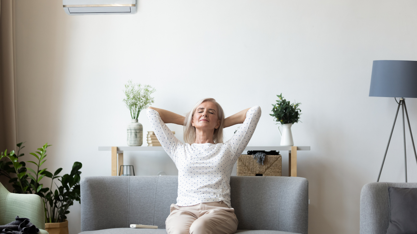 Woman sitting on a couch looking relaxed