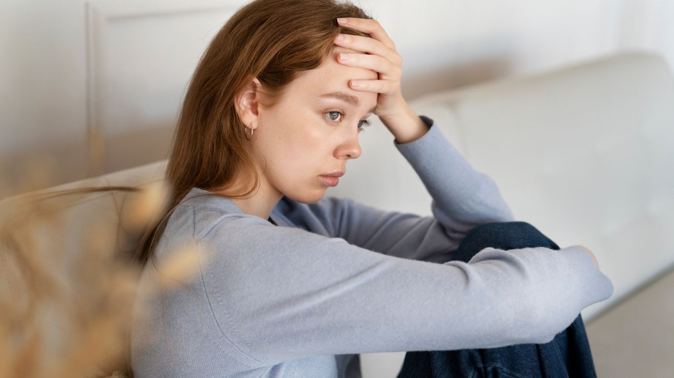 A woman looking despondent