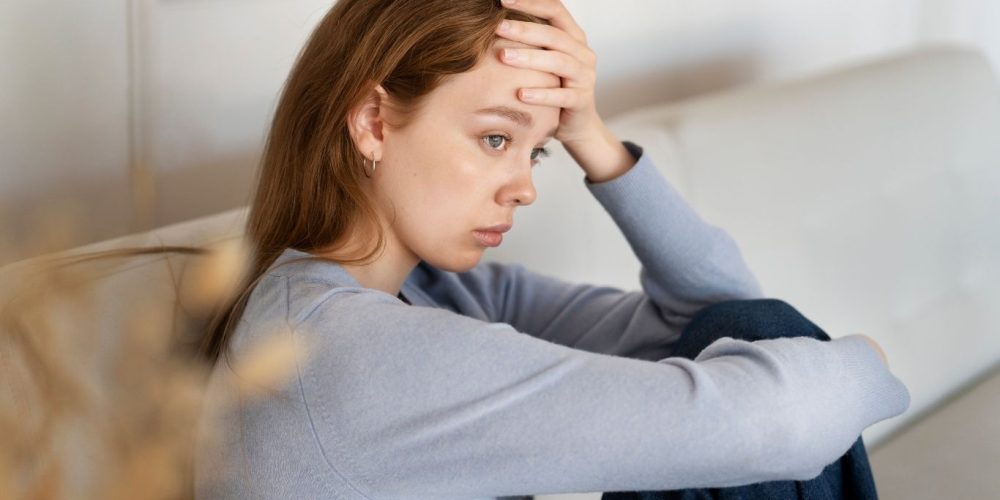 A woman looking despondent