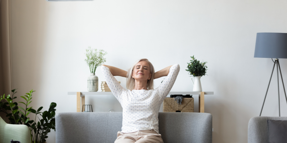 Woman sitting on a couch looking relaxed