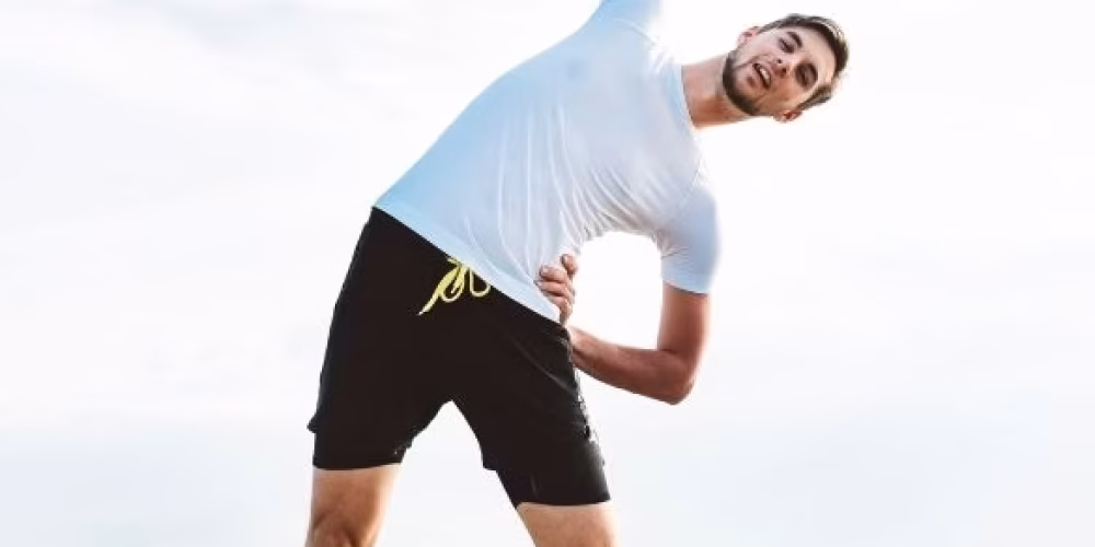 A man stretching gently using somatic movement